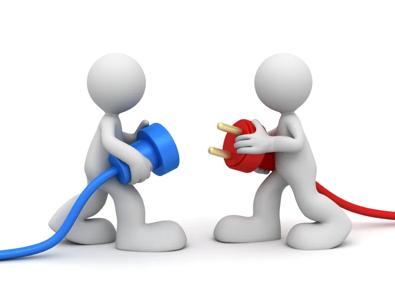 Two white figures connecting a blue plug and red socket